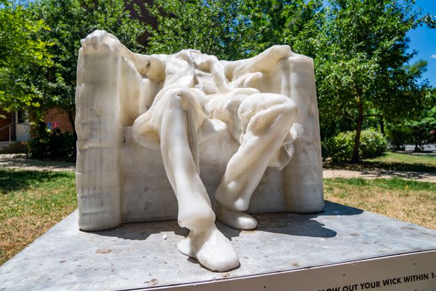 A wax replica of the Lincoln Memorial statue melts during a heat wave in Washington, DC, on June 24, 2024.