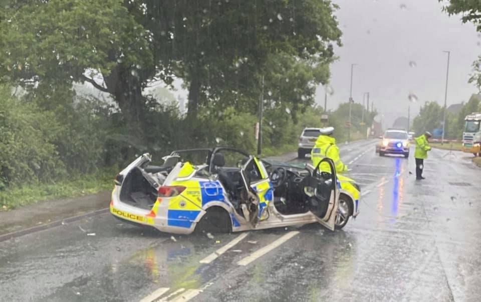 The police car was left completely crushed after the horror crash. (SWNS)