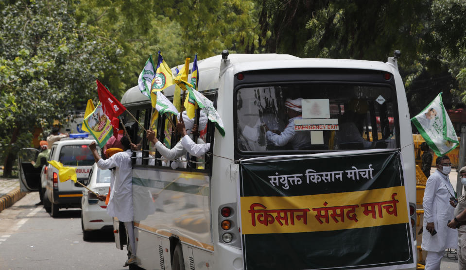 Indian farmers arrive at a protest site to hold mock farmer's parliament in New Delhi, India, Thursday, July 22, 2021. More than 200 farmers on Thursday began a protest near India's Parliament to mark eight months of their agitation against new agricultural laws that they say will devastate their income. (AP Photo/Manish Swarup)
