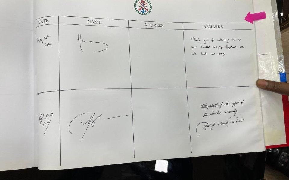 Both Prince Harry and the Duchess signed a visitors book to say thank you for their welcome