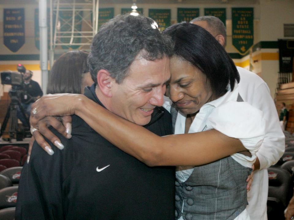 Former St. Vincent-St. Mary coach Keith Dambrot gets a hug from Gloria James in 2009 after LeBron was named the NBA Most Valuable Player.