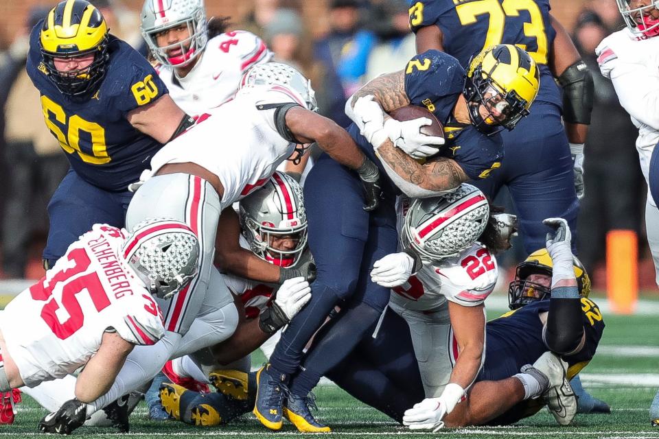 Michigan running back Blake Corum runs against the Ohio State defense during the second half at Michigan Stadium in Ann Arbor on Saturday, Nov. 25, 2023.