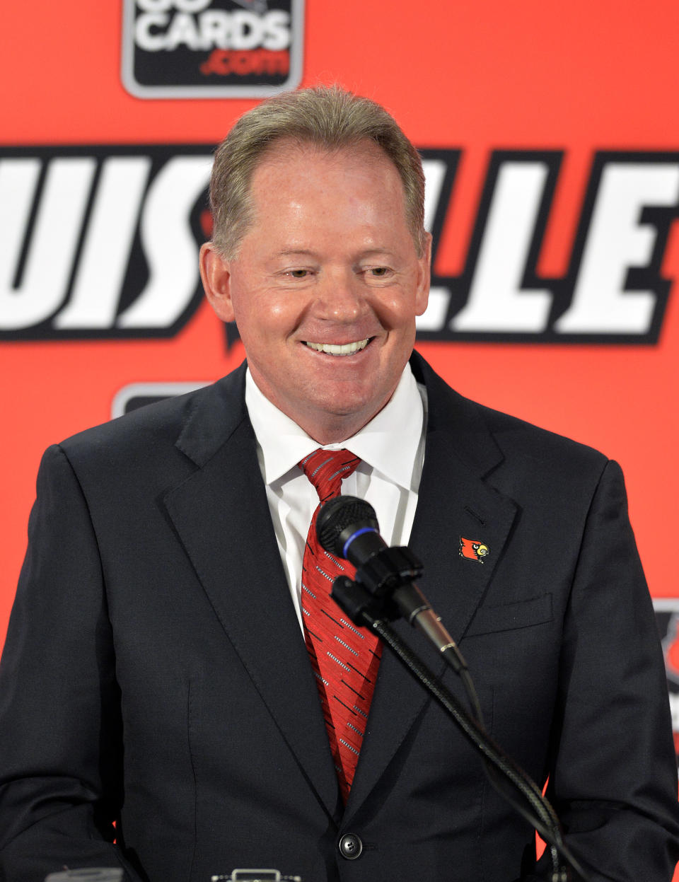 New Louisville head football coach Bobby Petrino address reporters following the announcement of his hiring Thursday, Jan. 9, 2014, at Papa John's Cardinal Stadium in Louisville, Ky. (AP Photo/Timothy D. Easley)