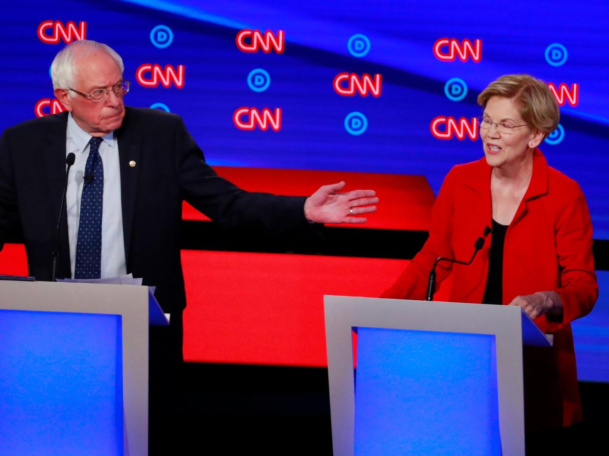 FILE PHOTO: U.S. Senator Bernie Sanders and U.S. Senator Elizabeth Warren speak on the first night of the second 2020 Democratic U.S. presidential debate in Detroit, Michigan, U.S., July 30, 2019. REUTERS/Lucas Jackson