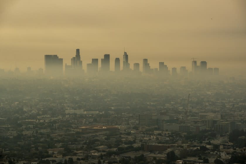 LOS ANGELES, CA - SEPTEMBER 17: Smoke from Southern California wildfires drifts through the L.A. Basin, obscuring downtown skyscrapers in a view from a closed Griffith Observatory on Thursday, Sept. 17, 2020 in Los Angeles, CA. (Brian van der Brug / Los Angeles Times)