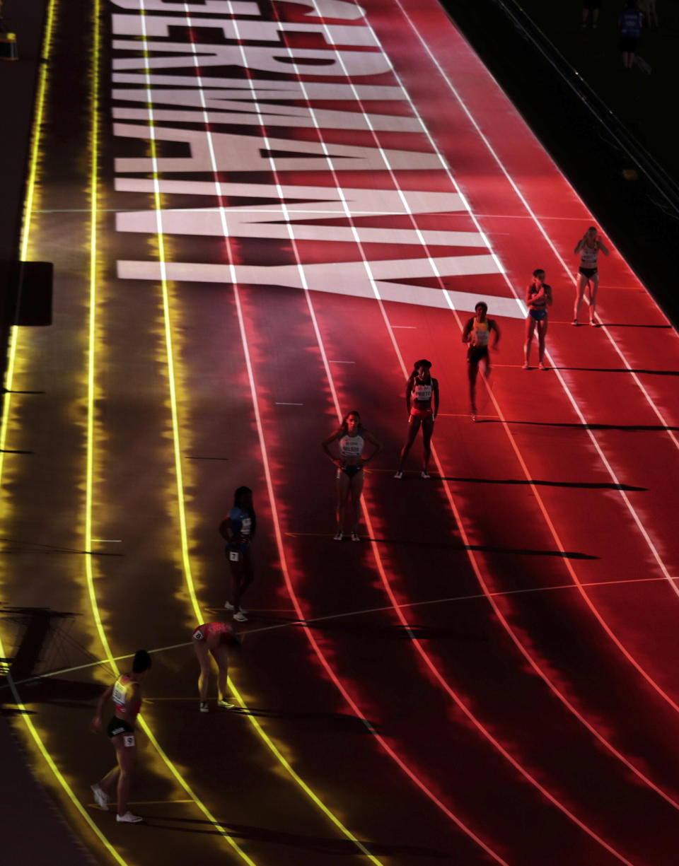 FILE - Competitors are introduced to the crowd before the women's 4x100 meter relay final at the World Athletics Championships in Doha, Qatar, Saturday, Oct. 5, 2019. The World Cup is just one way Qatar is using its massive wealth to project influence. By buying sports teams, hosting high-profile events, and investing billions in European capitals — such as buying London’s The Shard skyscraper — Qatar has been integrating itself into international finance and a network of support. (AP Photo/Nariman El-Mofty, File)