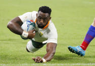 South Africa's Siya Kolisi scores a try during the Rugby World Cup Pool B game at the City of Toyota Stadium between South Africa and Namibia in Toyota City, Japan, Saturday, Sept. 28, 2019. (AP Photo/Christophe Ena)