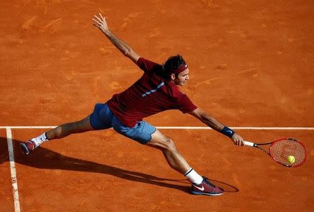 Tennis - Monte Carlo Masters - Monaco, 14/04/2016. Roger Federer of Switzerland plays a shot toRoberto Bautista Agut of Spain. REUTERS/Eric Gaillard