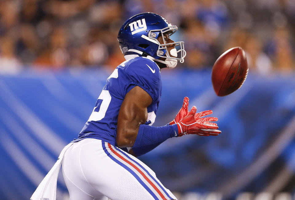 FILE - In this Friday, Aug. 16, 2019 file photo, New York Giants defensive back Corey Ballentine (25) makes catch during the first quarter of a preseason NFL football game against the Chicago Bears in East Rutherford, N.J. A day after making his regular season NFL debut with the New York Giants, Ballentine testified at a preliminary hearing about the day his best friend and former Washburn University teammate Dwane Simmons was shot to death. (AP Photo/Adam Hunger, File)