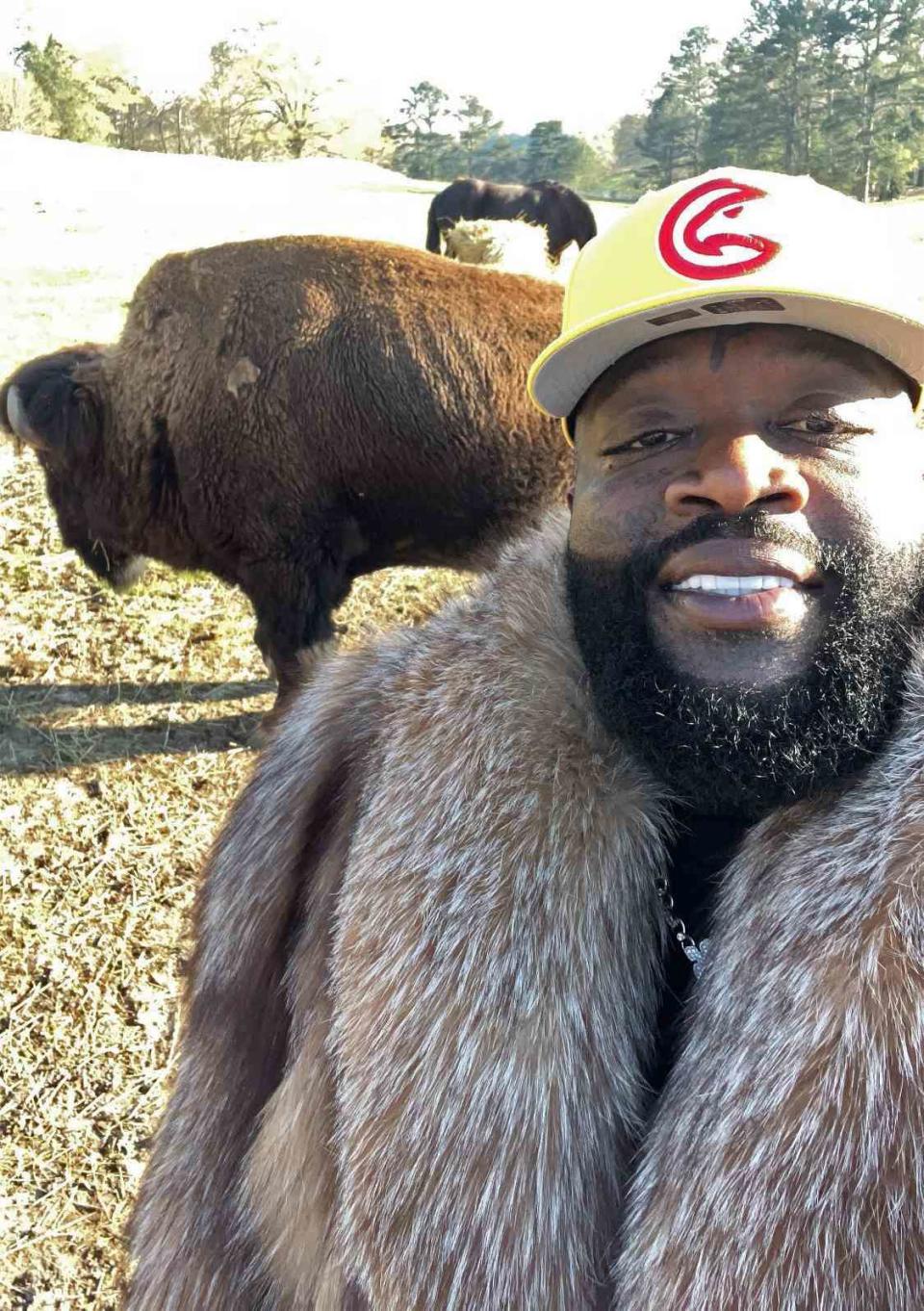 <p>Rick Ross/ Instagram</p> Rick Ross and his bison and horse