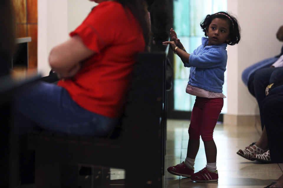 In this Sunday, Jan. 20, 2019 photo, a young girl attends mass at St. Mary's Catholic Church in Dubai, United Arab Emirates. Pope Francis’ visit to the United Arab Emirates from Feb. 3 through Feb. 5 marks the first ever papal visit to the Arabian Peninsula, the birthplace of Islam. The pontiff’s will visit Abu Dhabi, the headquarters of the Catholic Church’s Apostolic Vicariate of Southern Arabia, which covers the UAE, Oman and Yemen. (AP Photo/Jon Gambrell)