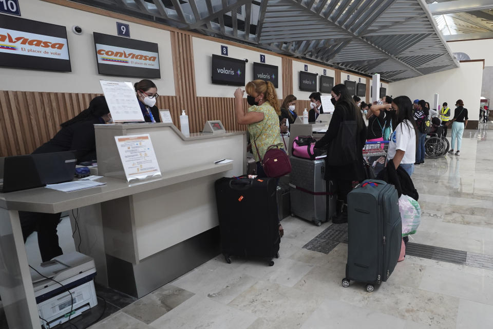 FILE - Passengers check in for their flight during the inauguration of the Felipe Angeles International Airport, AIFA, north of Mexico City, March 21, 2022. The airport was finished and inaugurated on March 21, 2022, but it remains little-used. (AP Photo/Marco Ugarte, File)