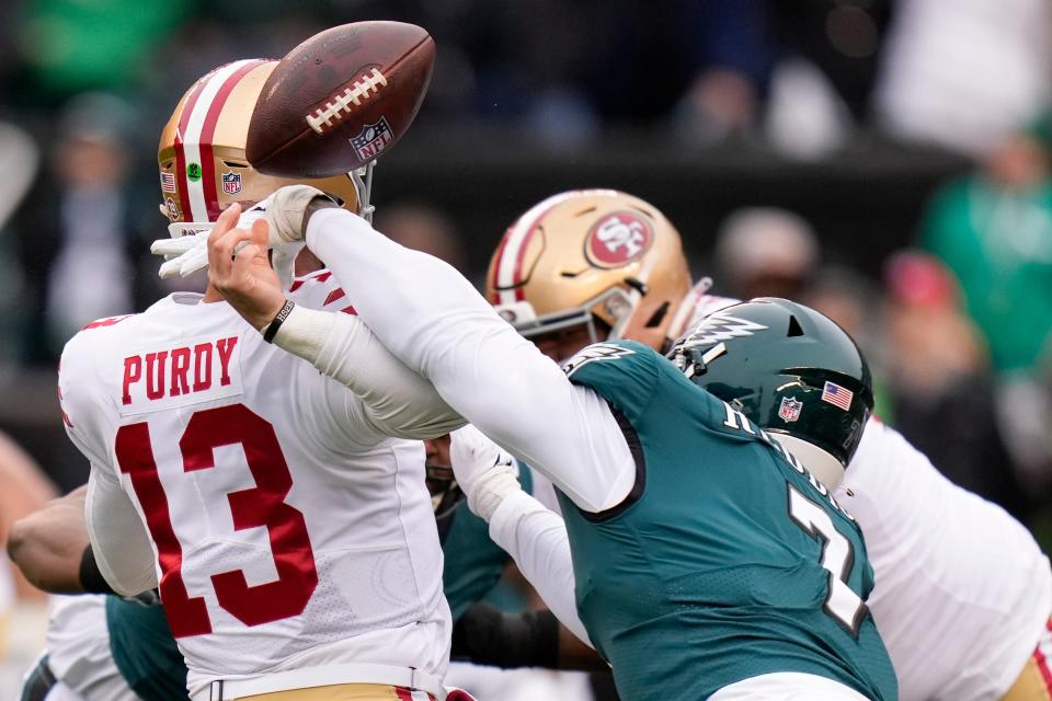 Philadelphia Eagles linebacker Haason Reddick, right, causes a fumble by San Francisco 49ers quarterback Brock Purdy during the first half of the NFC Championship NFL football game between the Philadelphia Eagles and the San Francisco 49ers on Sunday, Jan. 29, 2023, in Philadelphia.