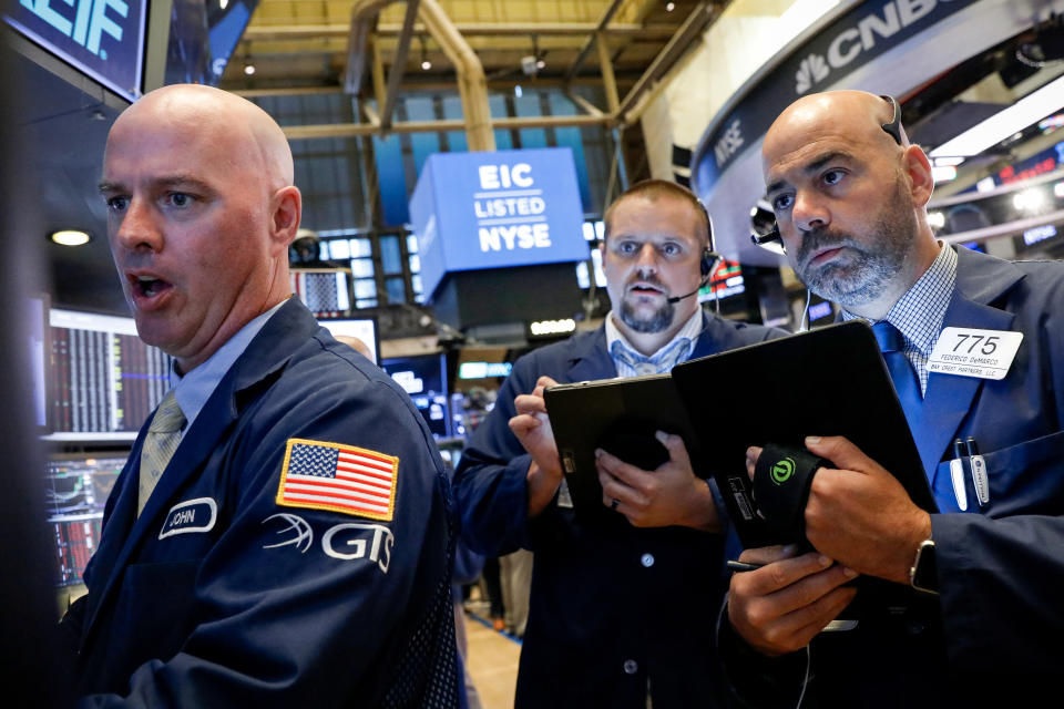 Traders work on the floor at the New York Stock Exchange (NYSE) in New York, U.S., August 7, 2019. REUTERS/Brendan McDermid