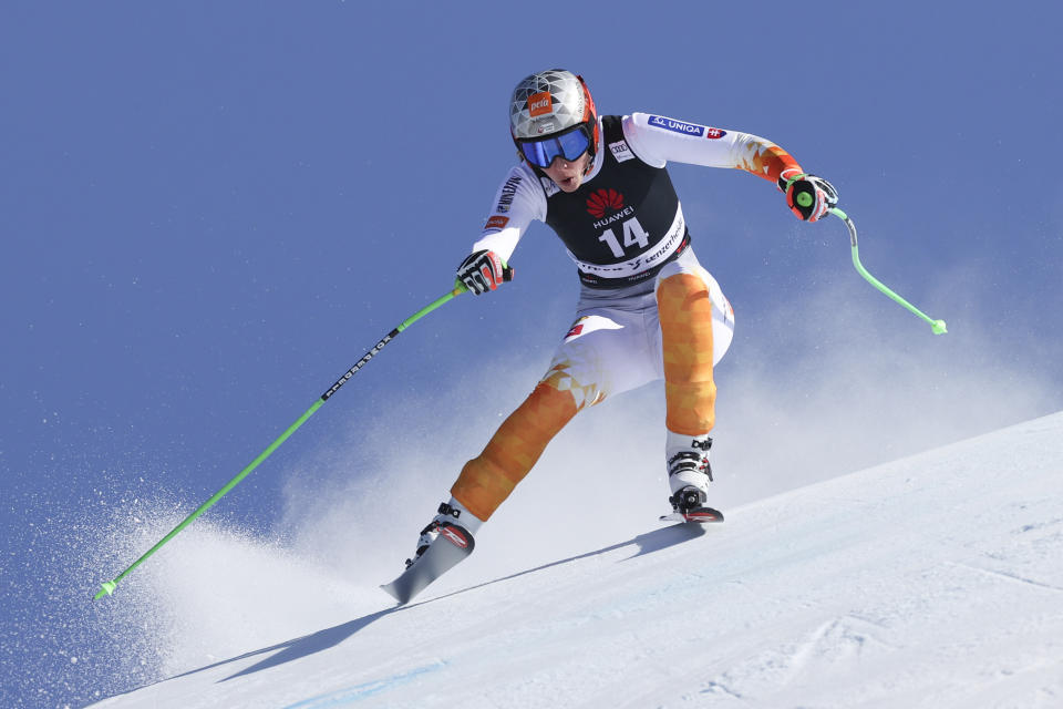 Slovakia's Petra Vlhova speeds down the course during an alpine ski, women's World Cup super-G, in Lenzerheide, Switzerland, Saturday, March 5, 2022. (AP Photo/Alessandro Trovati)