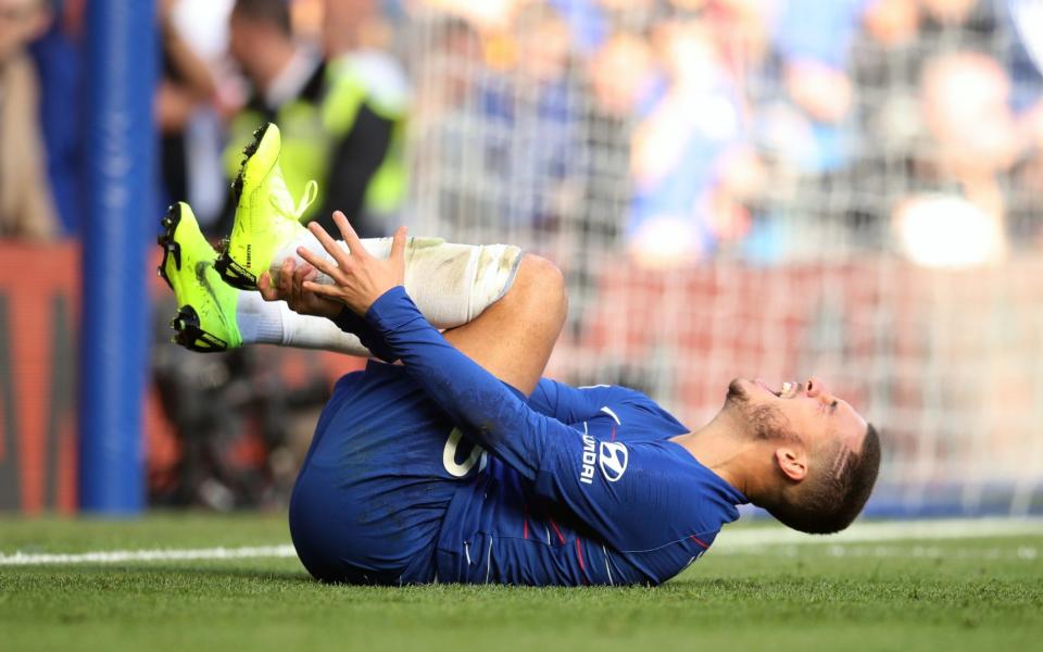 Eden Hazard has been complaining of back pain after the draw with Manchester United in which he was heavily fouled  - PA