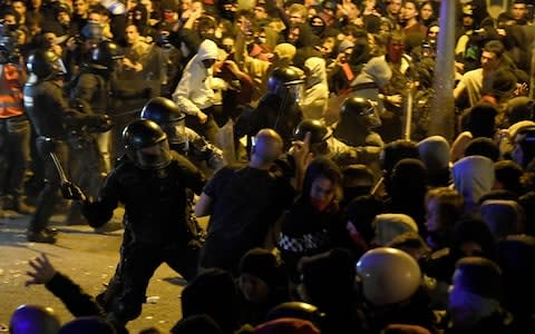 Protesters clash with Catalan regional police 'Mossos D'Esquadra' officers - Credit: LLUIS GENE/AFP via Getty Images