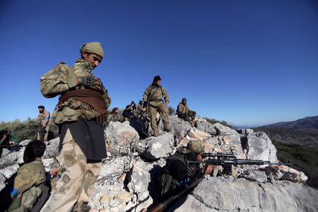 Turkish-backed Free Syrian Army fighters are seen near the city of Afrin, Syria February 19, 2018. REUTERS/Khalil Ashawi