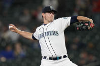 Seattle Mariners starting pitcher Chris Flexen throws to a Texas Rangers batter during the first inning of a baseball game Thursday, May 27, 2021, in Seattle. (AP Photo/Elaine Thompson)