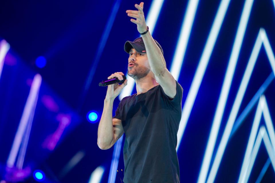 Nov 25, 2023; Phoenix, AZ, United States; Enrique Iglesias performs at the Trilogy Tour at the Footprint Center. Sam Ballesteros/The Republic