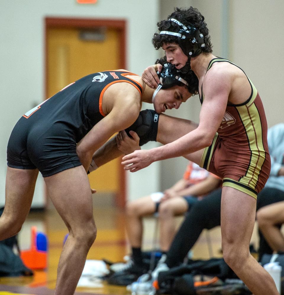 Marlborough High School wrestler Miguel Borges left and Algonquin Regional High School's Paulo Knapp, Jan. 18, 2023.