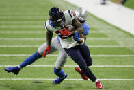 Detroit Lions free safety Will Harris tackles Houston Texans running back Duke Johnson (25) during the first half of an NFL football game, Thursday, Nov. 26, 2020, in Detroit. (AP Photo/Duane Burleson)