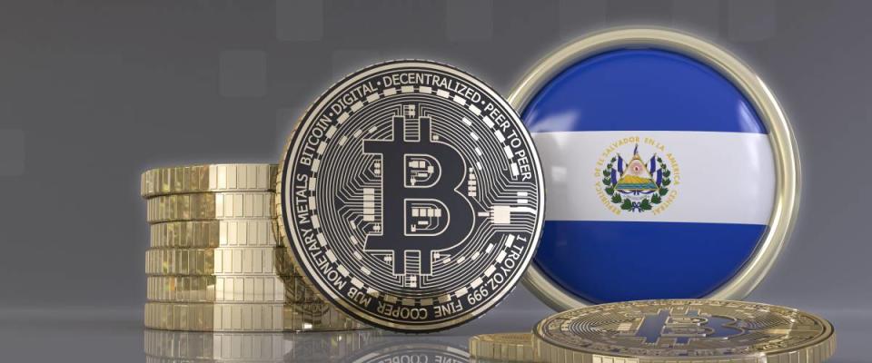 3d rendering of some metallic Bitcoins in front of an badge with the Salvadoran flag