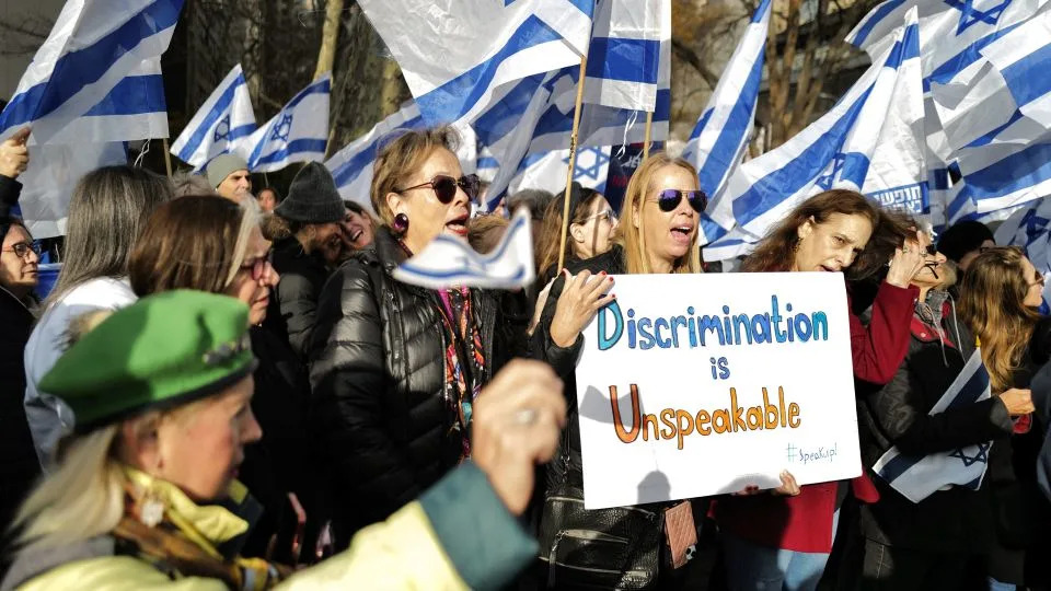 Demonstrators protest outside United Nations headquarters in New York City on December 4, 2023. - Charly Triballeau/AFP/Getty Images