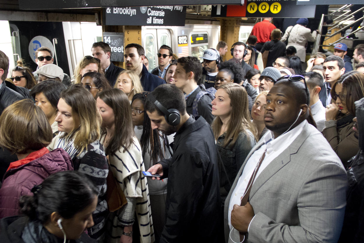 In this May 16, 2016 photo, commuters crowd a platform after exiting the L train in the Union Square subway station in New York. (AP Photo/Mark Lennihan)