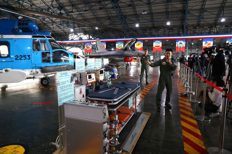 A navy officer introduces rescue equipment on EC225 Super Puma helicopters to the media during an annual New Year's drill in Chiayi