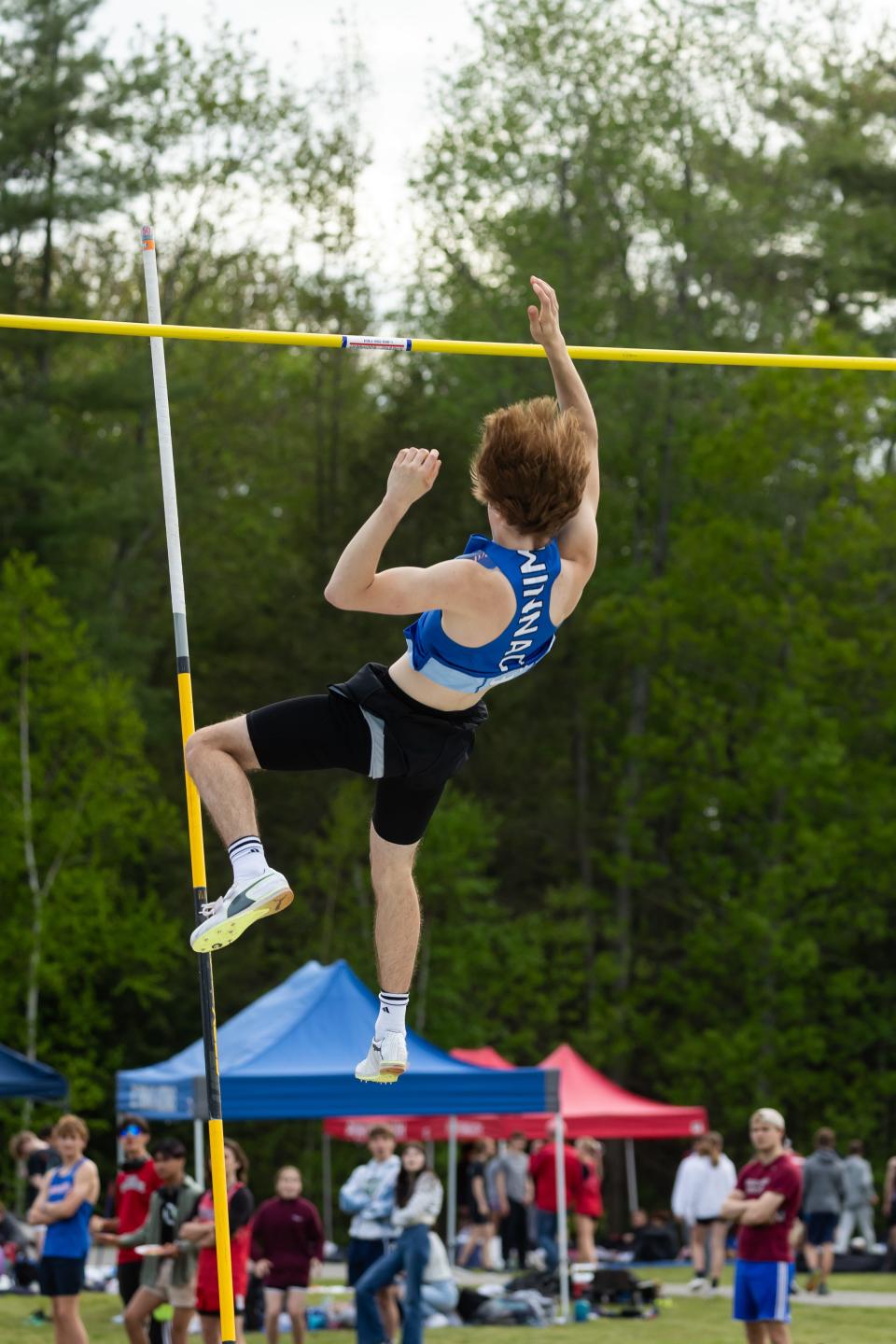 Winnacunnet's Wyatt Patterson wins the pole vault at Friday's Seacoast Track Championship meet at Exeter High School.