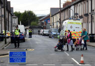 Women push their strollers past a police cordon after three men were arrested in connection with an explosion on the London Underground, in Newport, Wales, Britain, September 20, 2017. REUTERS/Rebecca Naden