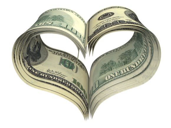 Stack of $100 bills shaped into a heart