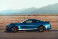 <p>Here's a fun fact about <a rel="nofollow noopener" href="https://www.caranddriver.com/ford/mustang-shelby-gt500" target="_blank" data-ylk="slk:the GT500;elm:context_link;itc:0;sec:content-canvas" class="link ">the GT500</a>: Its Eaton TVS R2650 supercharger is <a rel="nofollow noopener" href="https://www.caranddriver.com/news/a25891177/ford-mustang-shelby-gt500-supercharger-corvette-zr1/" target="_blank" data-ylk="slk:the same 2.7-liter unit;elm:context_link;itc:0;sec:content-canvas" class="link ">the same 2.7-liter unit</a> used in the 755-hp Chevrolet Corvette ZR1 and crams 12 psi of boost into an internally strengthened V-8. Another fun fact? Even though the 5.2-liter V-8 is based on the Voodoo engine used in the GT350, it lacks that model's special flat-plane crankshaft. </p>