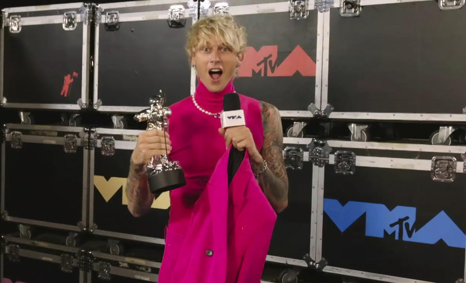 In this video grab issued Sunday, Aug. 30, 2020, by MTV, Machine Gun Kelly, also known as MGK, accepts the award for best alternative video for "Bloody Valentine" prior to the start of the MTV Video Music Awards. (MTV via AP)