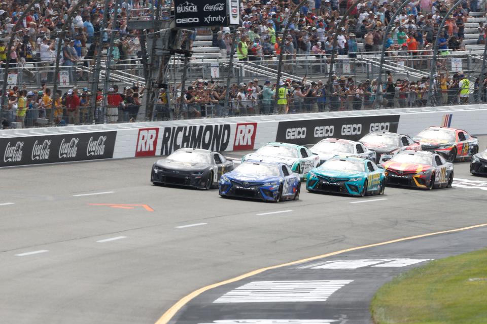 Tyler Reddick (45) and Kyle Busch (8) lead the field during a NASCAR Cup Series race at Richmond Raceway on July 30, 2023.