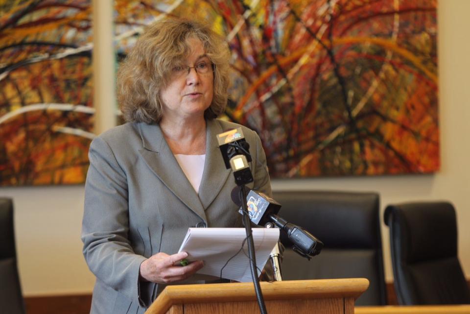 Johnson County attorney Janet Lyness speaks at a press conference.