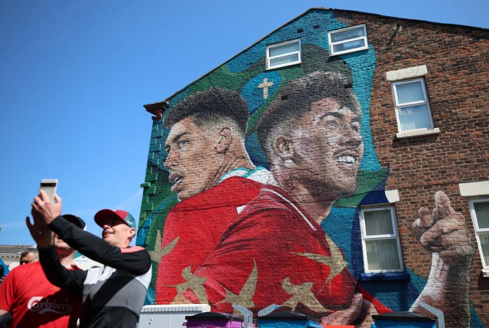 A mural celebrating Roberto Firmino outside Anfield (Reuters)