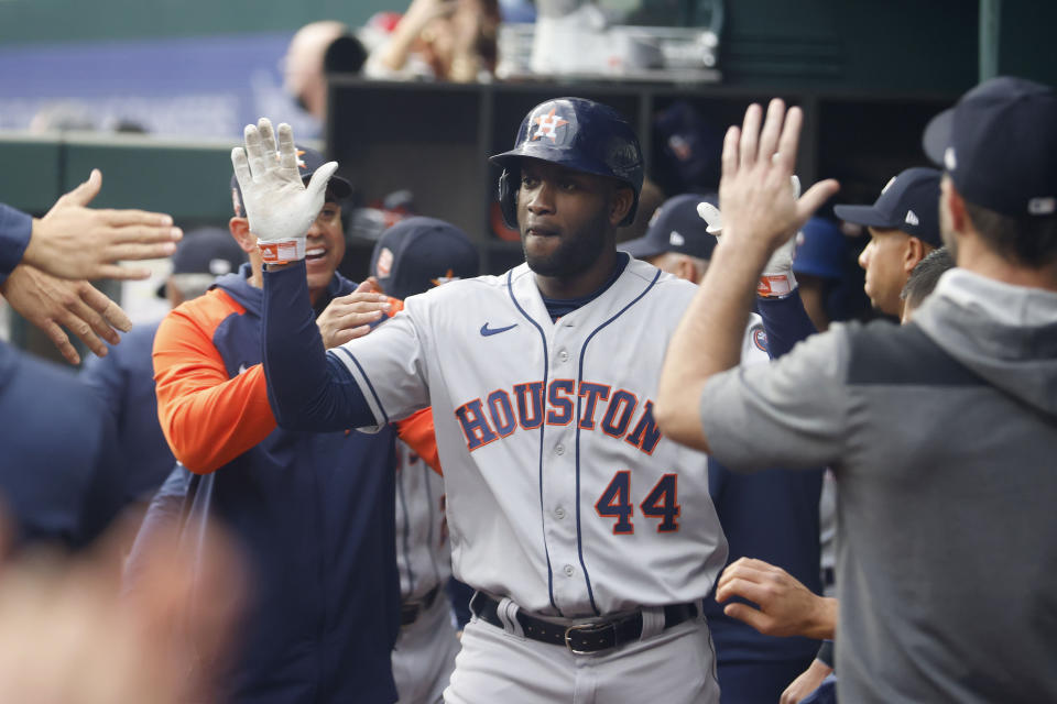 Houston Astros' Yordan Alvarez (44) is congratulated by teammates after he hit a solo home run against the Texas Rangers during the second inning of a baseball game Monday, April 25, 2022, in Arlington, Texas. (AP Photo/Michael Ainsworth)