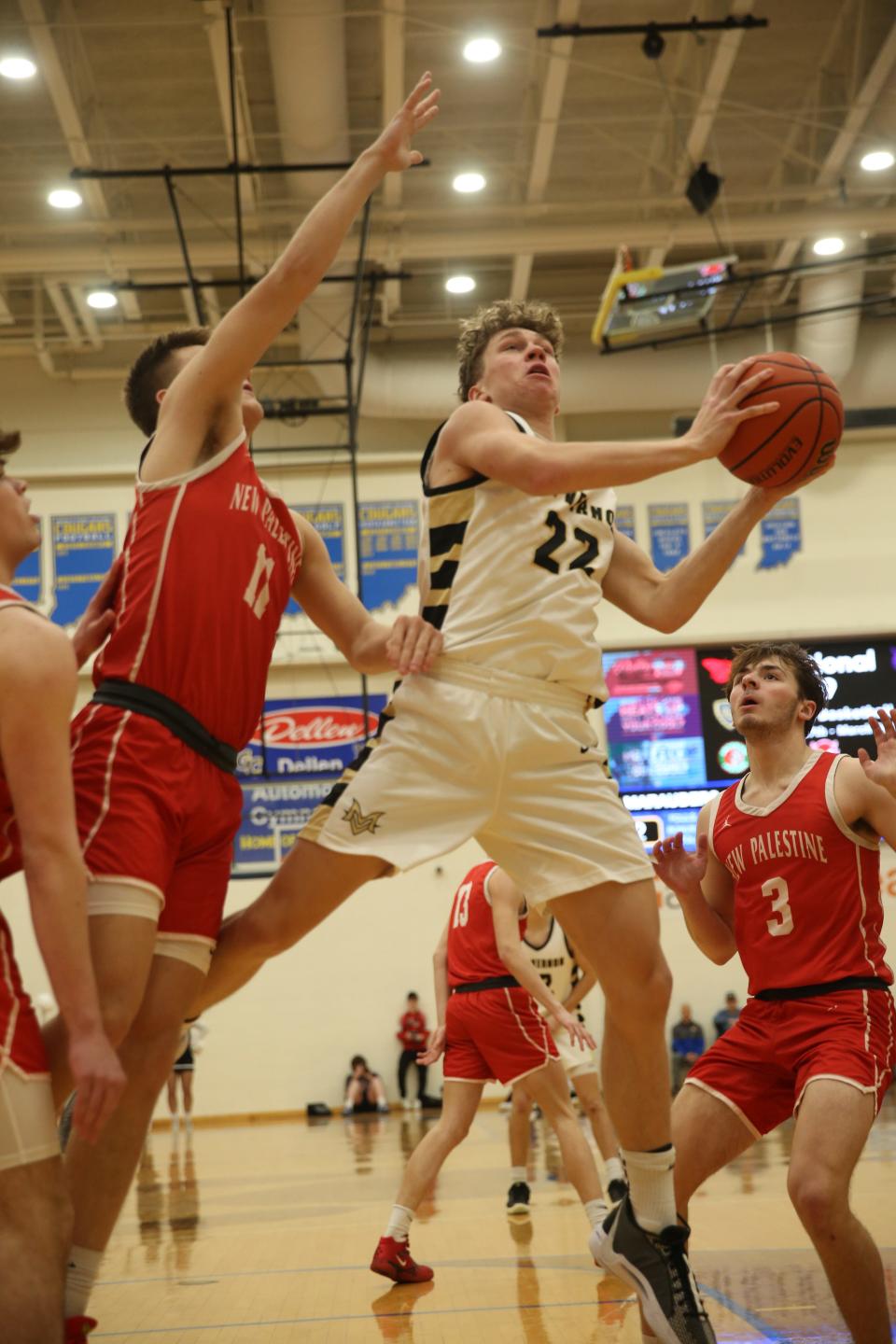 Mt. Vernon Tanner Teschendorf (22) drives in for a shot as New Palestine plays Mt. Vernon High School in the IHSAA Class 4A Boys Basketball S9 Sectional, Feb 27, 2024; Greenfield, IN, USA; at Greenfield-Central High School.