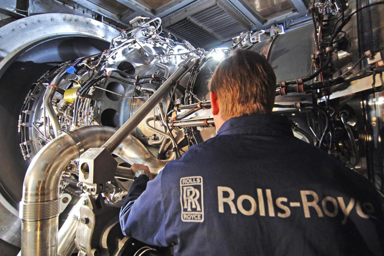 Undated handout file photo issued by Rolls Royce of a worker with the company's MT30 engine. Engine-maker Rolls-Royce has said cost cutting plans that will see it axe up to 2,500 jobs by the end of next year were 