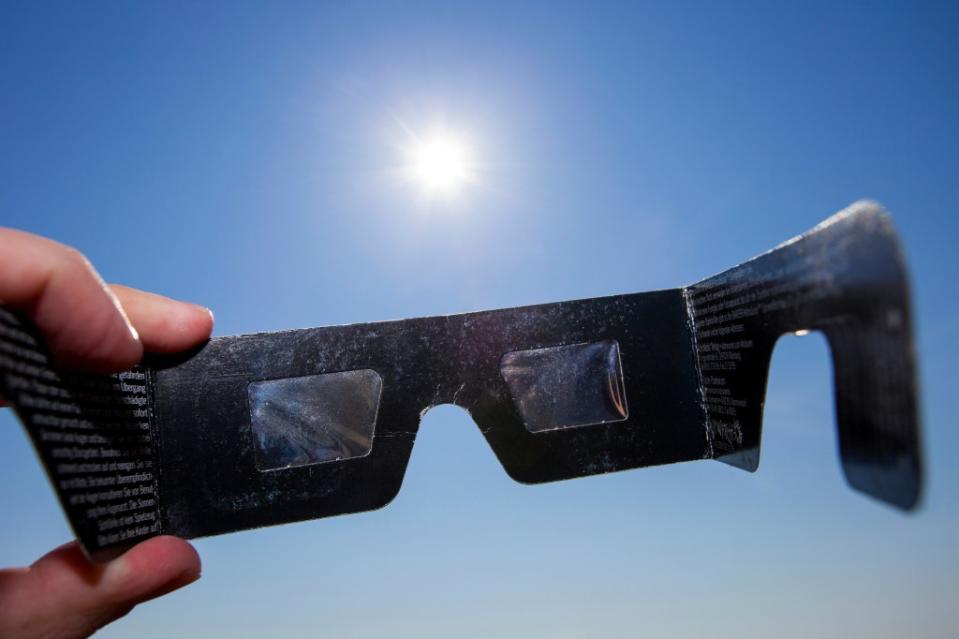 Those who are watching the eclipse will do well to view it through glasses designed specifically for that purpose. A_Bruno – stock.adobe.com