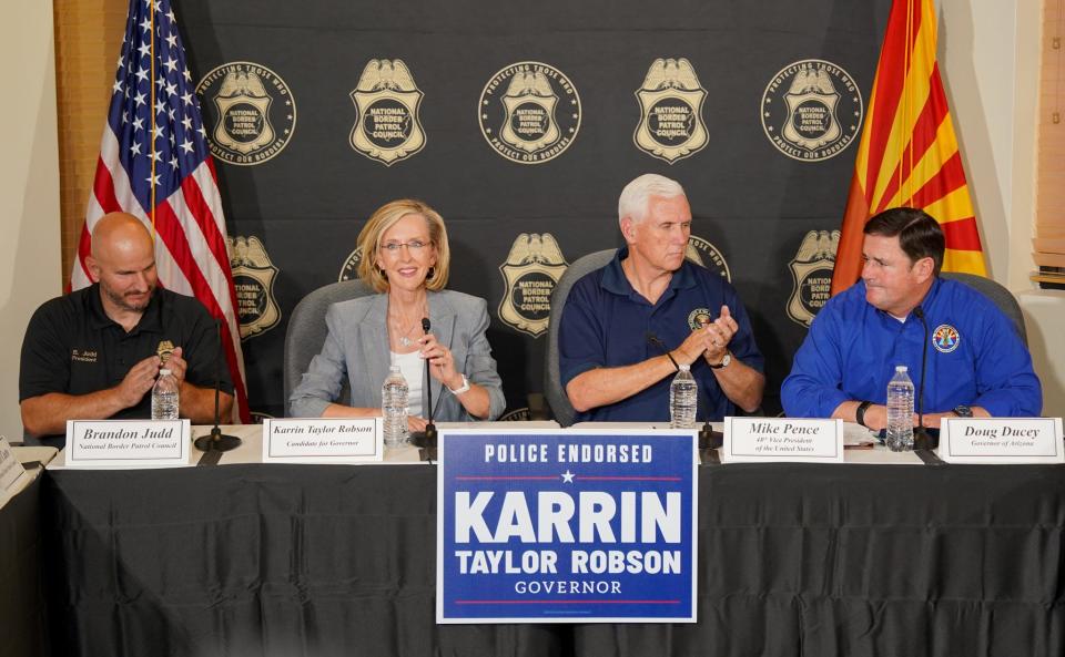 (From left to right) Arizona National Border Patrol Council President Brandon Judd, Republican gubernatorial candidate Karrin Taylor Robson, former Vice President Mike Pence and Gov. Doug Ducey meet during a border security briefing discussion at the National Border Patrol Council in Tucson on July 22, 2022.