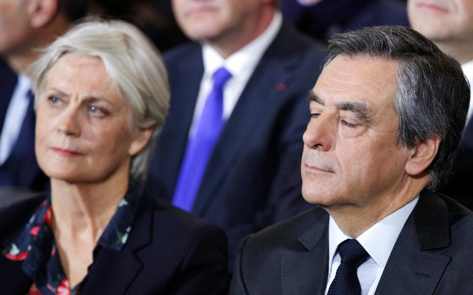 Francois Fillon and his wife Penelope attend a campaign meeting in Paris. - Credit: Christophe Ena/AP