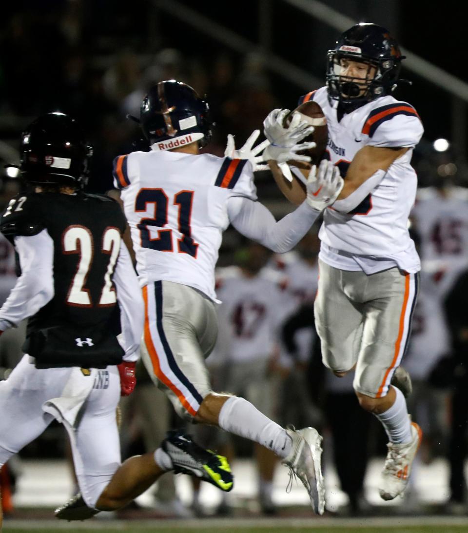 Harrison cornerback Sammy Hallada (29) intercepts a pass to seal Harrison's 34-27 victory over Lafayette Jeff.