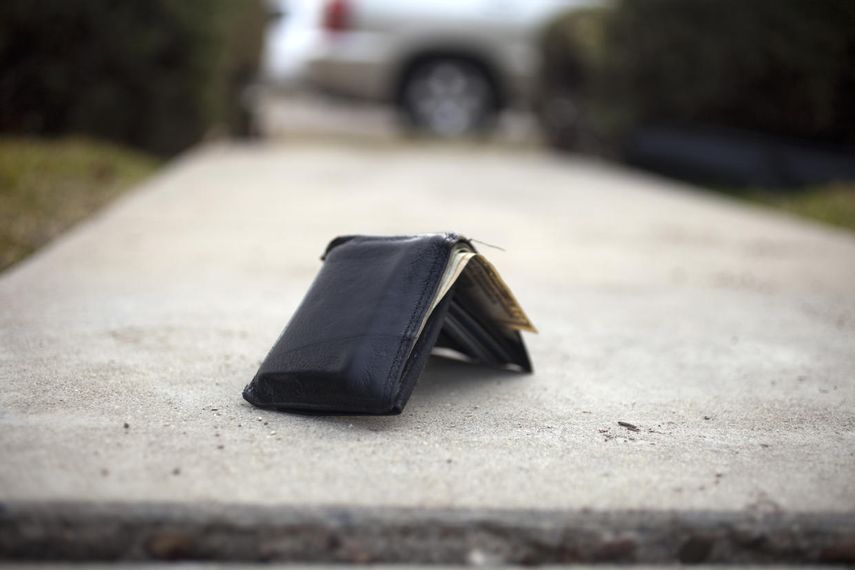 a lost wallet on the sidewalk