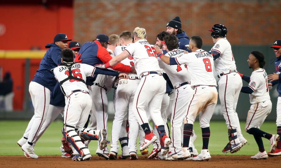 The Braves celebrate their walk-off win over the Dodgers in Game 1 of the NLCS.