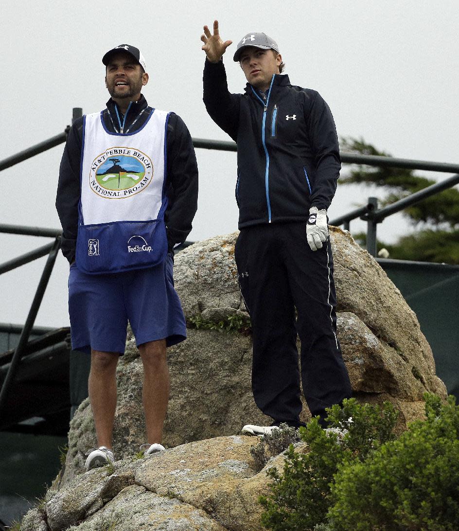 Jordan Spieth, right, gestures beside his caddy, Michael Greller, on the 11th tee Friday, Feb. 7, 2014, during the second round of the AT&T Pebble Beach Pro-Am golf tournament on the Monterey Peninsula Country Club Shore Course in Pebble Beach, Calif. (AP Photo/Ben Margot)