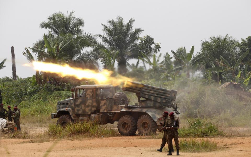 Congolese soldiers launch missiles during their military operation against ADF-NALU rebels outside the town of Beni