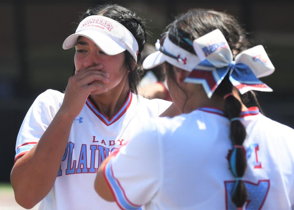 Monterey's Anays Perez, left, reacts after a loss to Aledo in Game 2 of their Region I-5A final series Friday, May 27, 2022, at Poly Wells Field in Abilene.